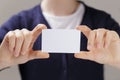 Female teen hands holding business card Royalty Free Stock Photo