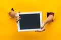 Female teen hands using tablet pc with black screen, isolated Royalty Free Stock Photo