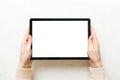 Female teen hands using tablet pc with white screen, mockup image of woman hand holding white tablet pc with blank white Royalty Free Stock Photo