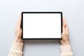 female teen hands using tablet pc with white screen, Mockup image of woman hand holding white tablet pc with blank white Royalty Free Stock Photo