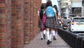 Female Teen Students Walking To School