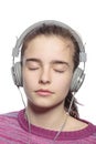 Female teenager with earphones and closed eyes