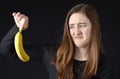 Teenager disgusted with bananna Royalty Free Stock Photo