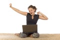 Female teenager yawning on the carpet with laptop