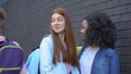 Female teenagers laughing at new student passing by, school rejection, offend