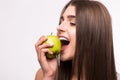 Female teeth and apple. Healthy eating on white background