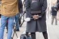 Female television journalist holding microphone and waiting for media event or news conference Royalty Free Stock Photo