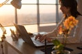 Female teleworker texting using laptop and internet, working online. Freelancer typing at home office, workplace. Royalty Free Stock Photo