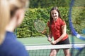 Female Tennis Coach Giving Lesson To Girl Royalty Free Stock Photo