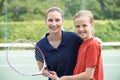 Female Tennis Coach Giving Lesson To Girl Royalty Free Stock Photo