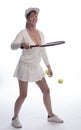 Female tennis player bounces ball