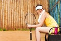 Female tennis player having rest after the game Royalty Free Stock Photo