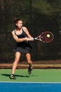 Female Tennis Player Hits Powerful Backhand Royalty Free Stock Photo