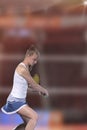 Female tennis player reaching to hit the tennis ball on court Royalty Free Stock Photo