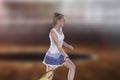 Female tennis player reaching to hit the tennis ball on court Royalty Free Stock Photo