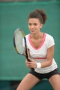 Female tennis player in receiving service stance Royalty Free Stock Photo