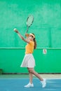 female tennis player serving the ball with a racket Royalty Free Stock Photo