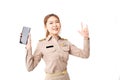 Female Thai government officer in khaki uniforms smiling on white background. Cheerful Asian woman holding smartphone for shopping