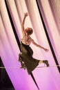 Female tightrope walker performs in a circus