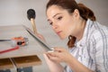 female tiler using mallet to fit edging strip Royalty Free Stock Photo