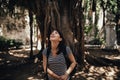 Female tourist backpacker visiting Italy.Woman in Syracuse,Sicily.Beautiful park in Syracuse, Ortigia island visitor.Historical tr