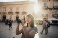 Female tourist backpacker visiting Italy.Woman in Syracuse,Sicily.Old town of Syracuse, Ortigia island visitor.Travel destination