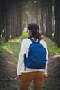 Female tourist with blue backpack