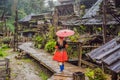 A female tourist dressed in the traditional dress of the inhabitants of the Vietnamese mountains, the Hmong. Woman in