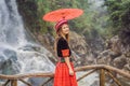 A female tourist dressed in the traditional dress of the inhabitants of the Vietnamese mountains, the Hmong. Woman in