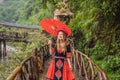A female tourist dressed in the traditional dress of the inhabitants of the Vietnamese mountains, the Hmong. Woman in