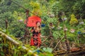 A female tourist dressed in the traditional dress of the inhabitants of the Vietnamese mountains, the Hmong. Woman in