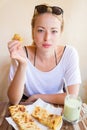 Woman eating traditional moroccan breakfast in coffee shop.