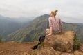 Female tourist enjoying beautiful view of tea plantations, Sri Lanka.