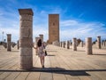 Female tourist enjoying the beautiful view of Tour Hassan in Rabat, Morocco Royalty Free Stock Photo