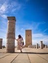 Female tourist enjoying the beautiful view of Tour Hassan in Rabat, Morocco Royalty Free Stock Photo