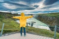 Female tourist enjoying on viewpoint of Gullfoss waterfall with hvita river flowing in canyon at Iceland Royalty Free Stock Photo