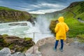 Female tourist enjoying on viewpoint of Gullfoss waterfall with hvita river flowing in canyon at Iceland Royalty Free Stock Photo