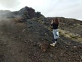 Tourist enjoying volcanic scenery in Iceland