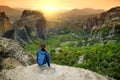 Female tourist exploring Meteora valley, a rock formation in central Greece hosting one of the largest complexes of Eastern Royalty Free Stock Photo