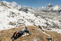 Female Tourist Hikking at gokyo ri mountain peak near gokyo lake during Everest base camp trekking in nepal