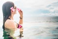 Female Tourist in infinity pool of hotel resort Royalty Free Stock Photo