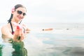 Female Tourist in infinity pool of hotel resort Royalty Free Stock Photo