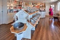 Female tourist making her choice in Bolcheriet - famous hard candy manufacture and store in Svaneke