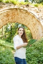 Female tourist with map sightseening arch bridge Royalty Free Stock Photo