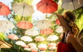 Female tourist marvels at baldachin of umbrellas Royalty Free Stock Photo