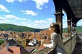 Young woman in front of the city of Sighisoara, Romania Royalty Free Stock Photo