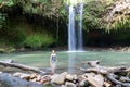 Woman Posing for photo at Maui, Hawaii Waterfall - Twin Falls in Motion, tourist stop on the Road to Hana Royalty Free Stock Photo