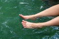 Female Tourist Relaxing Her Happy Legs in the Hotspring Water Pond Royalty Free Stock Photo