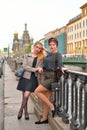 Female tourist resting at the gate of the Griboyedov Canal emban Royalty Free Stock Photo