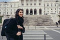 Female tourist standing in front of the Parliament of Portugal, Assembly of the Republic